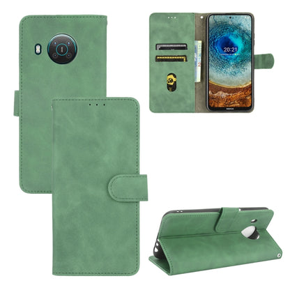 Solid Color Skin Feel Magnetic Buckle Horizontal Flip Calf Texture PU Leather Case with Holder & Card Slots & Wallet