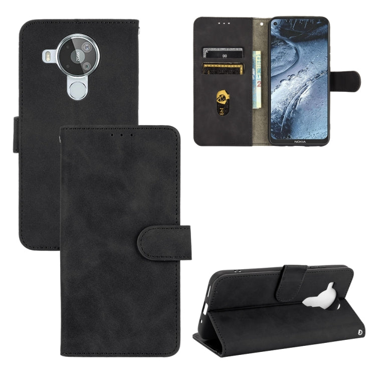 Solid Color Skin Feel Magnetic Buckle Horizontal Flip Calf Texture PU Leather Case with Holder & Card Slots & Wallet