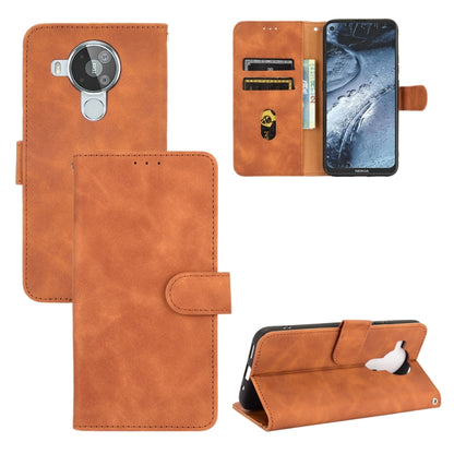 Solid Color Skin Feel Magnetic Buckle Horizontal Flip Calf Texture PU Leather Case with Holder & Card Slots & Wallet