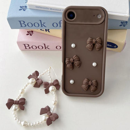 Soft Silicone 3D Bowknot Pearl Phone Case with Beaded Wrist Strap, For iPhone 17 Pro Max, For iPhone 17 Pro, For iPhone 17, For iPhone Air, For iPhone 16 Pro Max, For iPhone 16 Pro, For iPhone 16, For iPhone 15 Pro Max